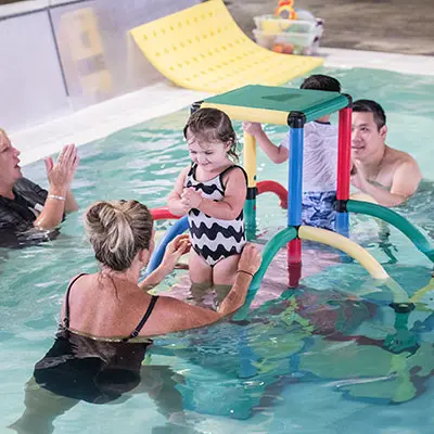 swim-school-10 Parents with their children in swim school