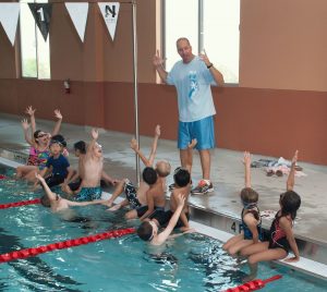 coach w/students in the pool