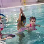 students in the water