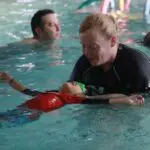 swim instructor working with a student