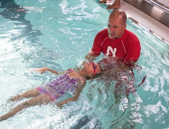 Teaching a young girl to swim