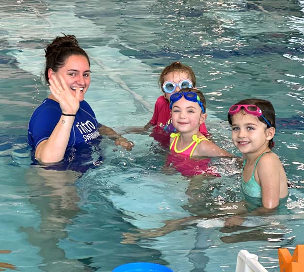 Instruction with students in swim school
