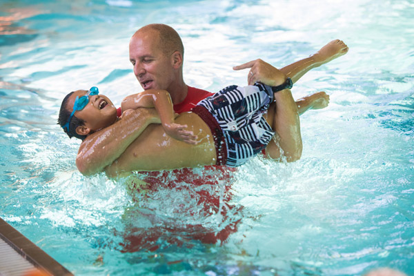 child learning to swim