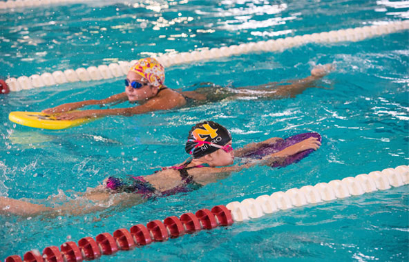 Swim students getting swimming lessons